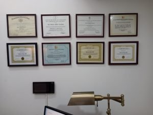 Diplomas on wall.