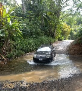 Car crossing river near Playa Ventanas Costa RICA.